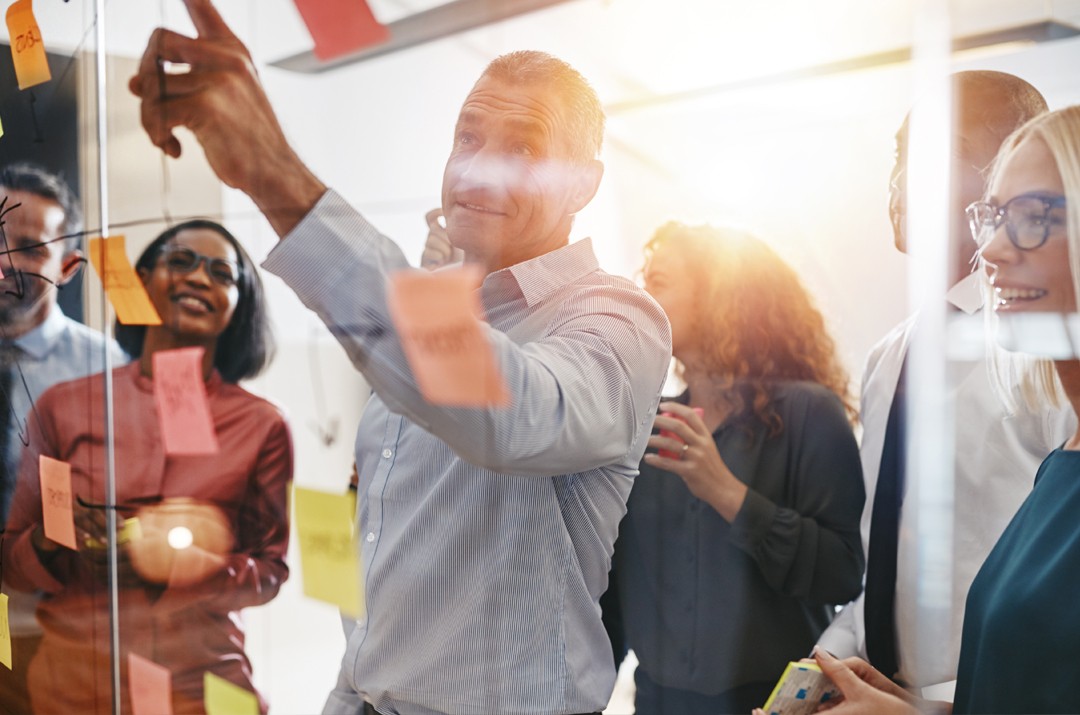 Photo of leader teaching colleagues value of customer experience