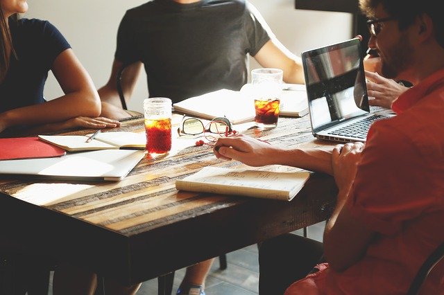 Business people collaborate around a table