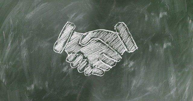 A drawing of a firm handshake